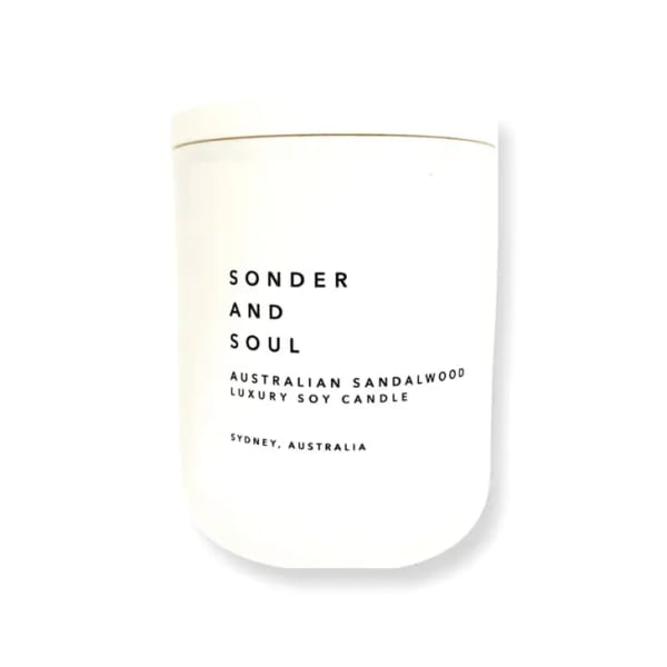 White candle jar labeled Sonder and Soul