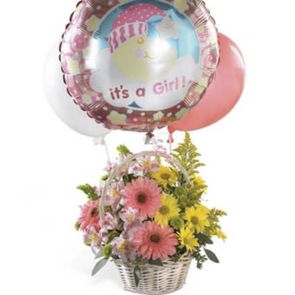 Basket of pink and yellow flowers with a "it's a Girl!" balloon