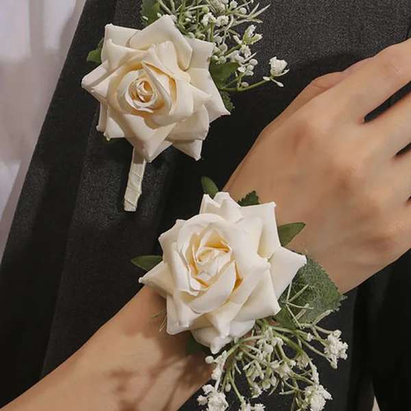 White rose boutonniere and wrist corsage with baby's breath