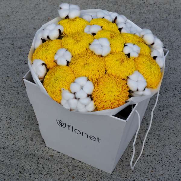 Yellow chrysanthemum bouquet with white cotton in a white gift box