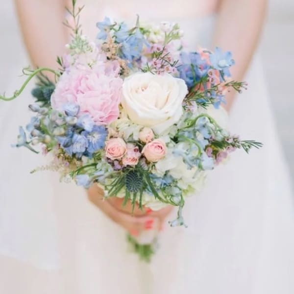 Pastel bouquet with white, pink, and blue flowers