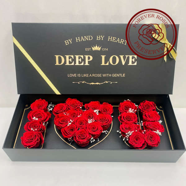 Red roses arranged in a black gift box spelling "DEEP LOVE"