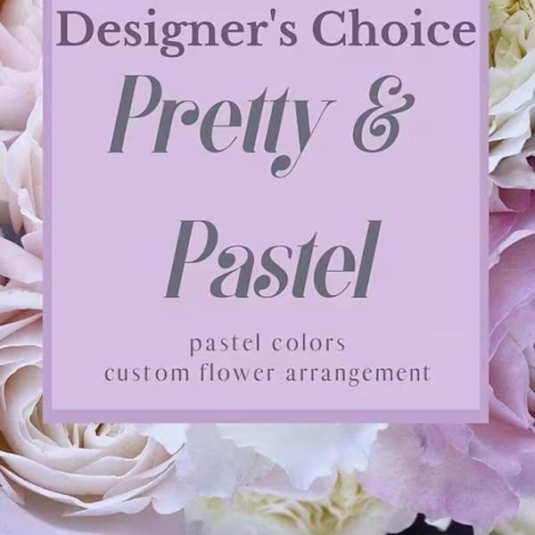 Pastel roses and white flowers behind a pink sign reading Designer's Choice Pretty & Pastel