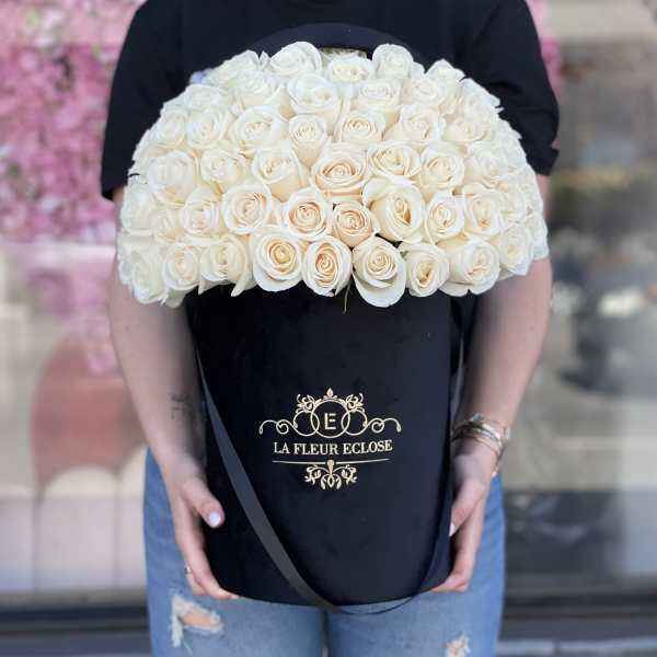Large bouquet of cream roses in a black presentation box