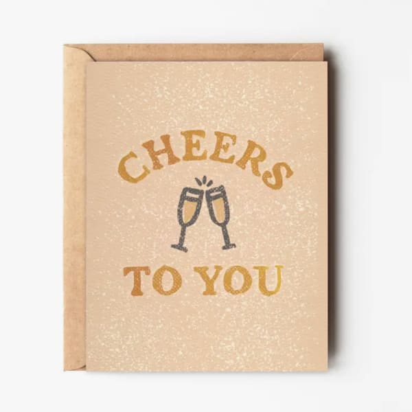 Greeting card with champagne glasses and the words Cheers to You