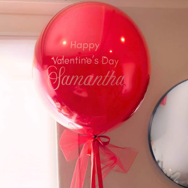 Red Valentine’s Day balloon with a ribbon bow