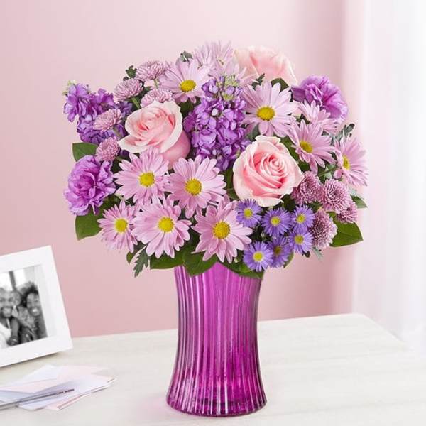 Pink and purple bouquet in a magenta vase