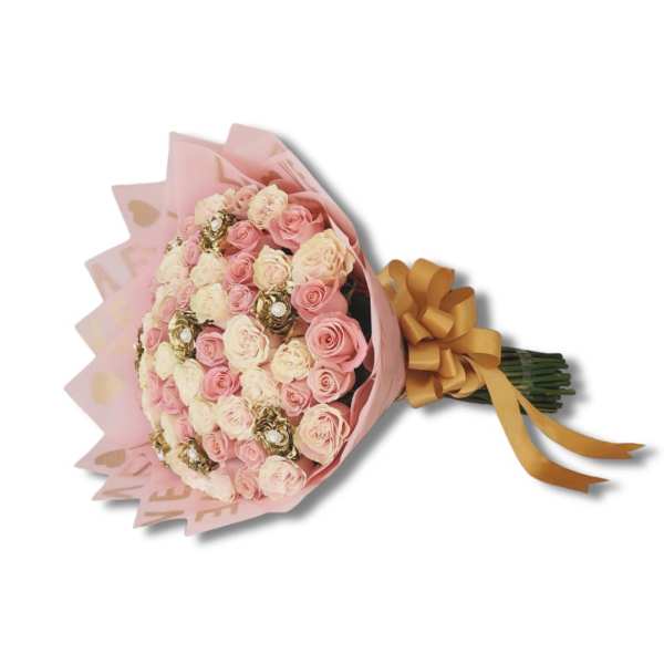 Bouquet of pink and cream roses wrapped in pink paper with a gold ribbon