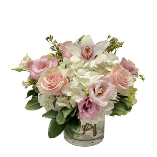 Pink and white bouquet in a clear glass vase