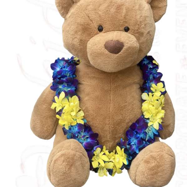 Plush teddy bear wearing a blue and yellow flower lei