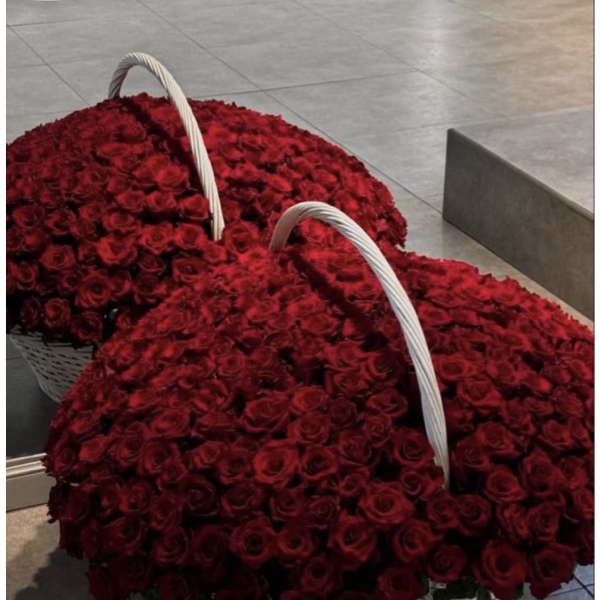 Two large baskets filled with red roses