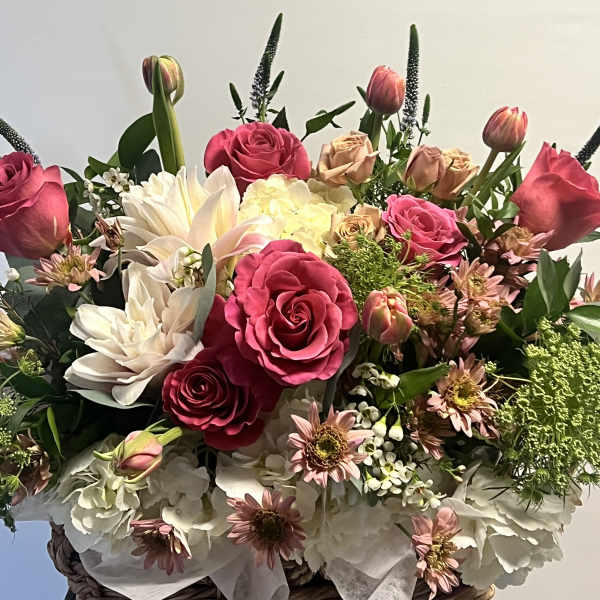 Bouquet of pink and cream roses with white lilies and tulips
