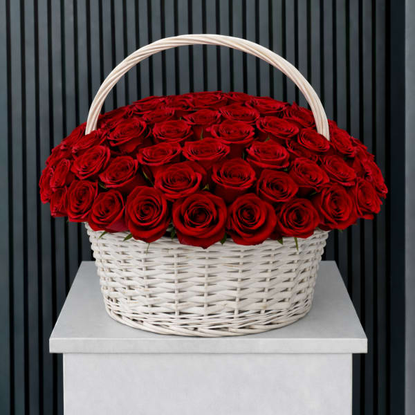 Basket of red roses with a white handle