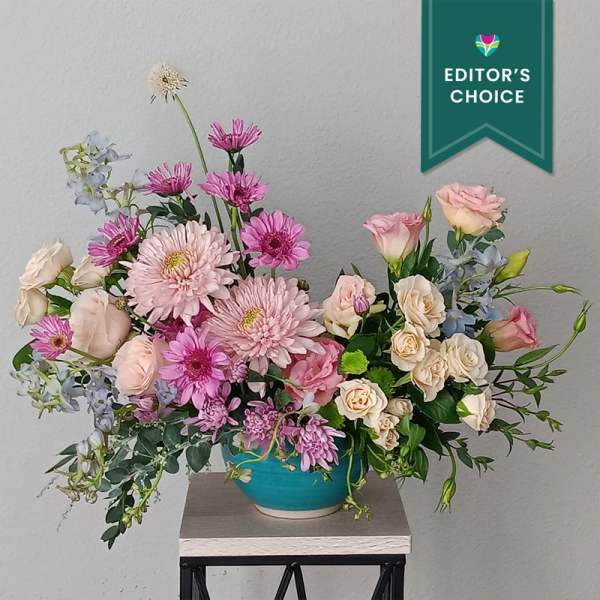 Pink and cream mixed bouquet in a turquoise bowl vase