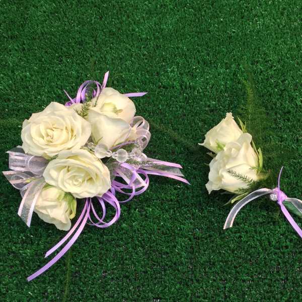 White rose bouquet and matching boutonniere with lavender ribbon