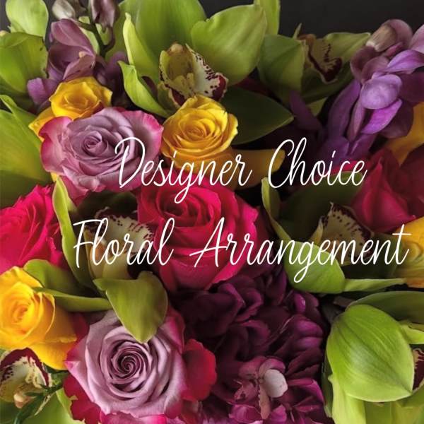 Mixed bouquet of roses and orchids in bright pink, yellow, purple, and green
