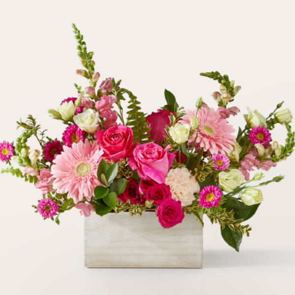 Pink and white mixed flower arrangement in a rectangular wooden box