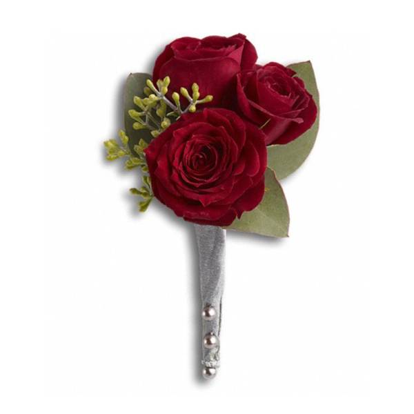 Three red roses arranged as a boutonniere with a silver stem wrap