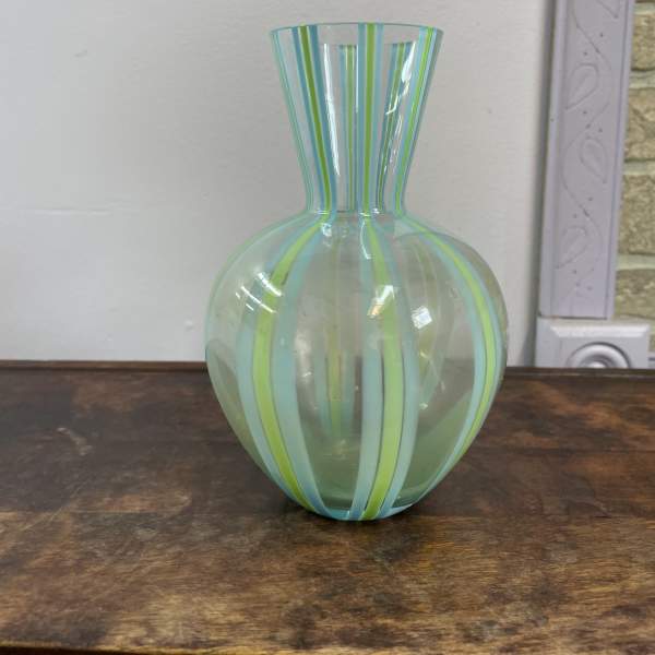 Striped glass vase with a rounded body and flared neck