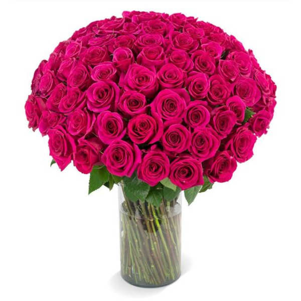 Bouquet of hot pink roses in a clear glass vase