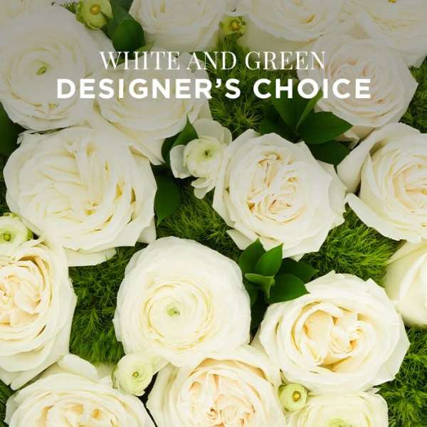 Close-up of white roses and ranunculus over mossy green accents with text reading White and Green Designer's Choice