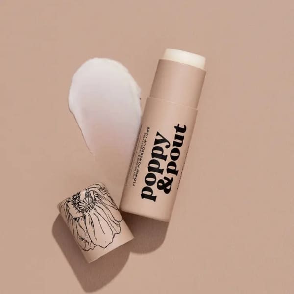 Two lip balm tubes with one cap off and a white balm stick exposed
