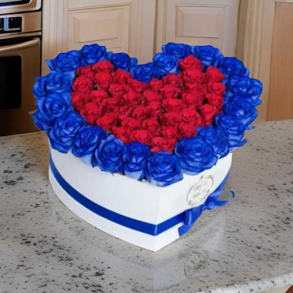 Heart-shaped box filled with red and blue roses