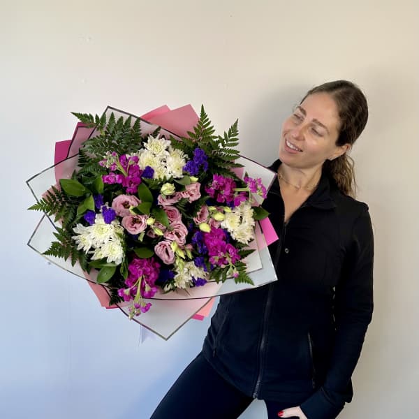 Large mixed bouquet of pink, white, and purple flowers