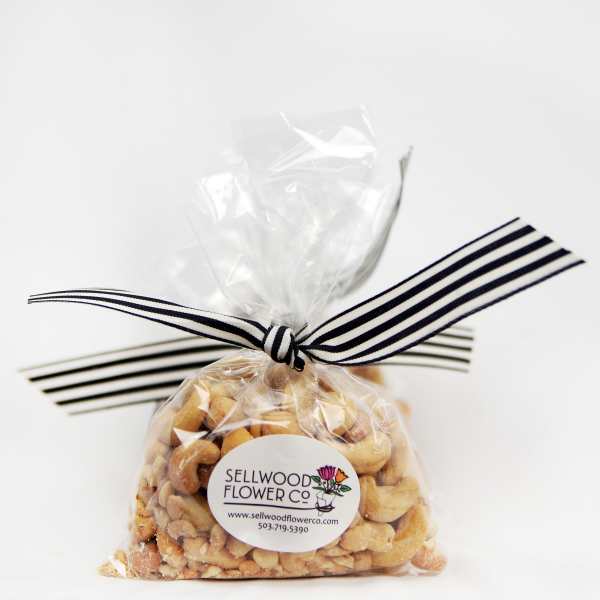 Bag of mixed nuts tied with a striped ribbon
