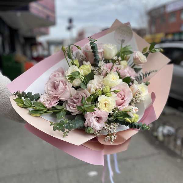 Pink and white bouquet with roses and small filler flowers