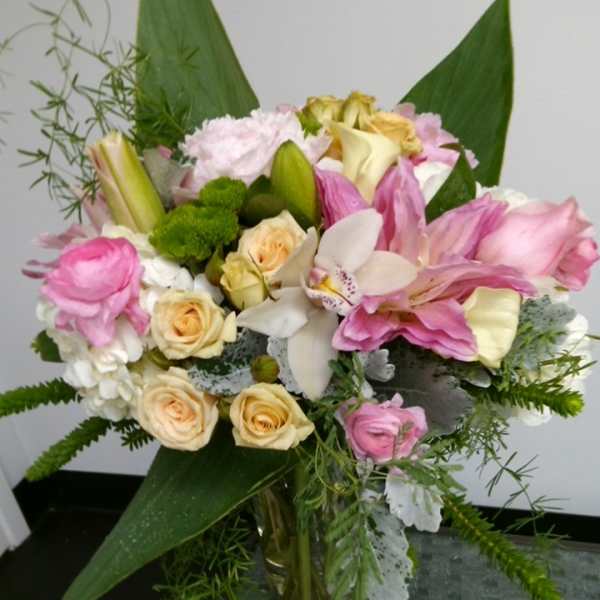 Pink and cream mixed bouquet in a glass vase