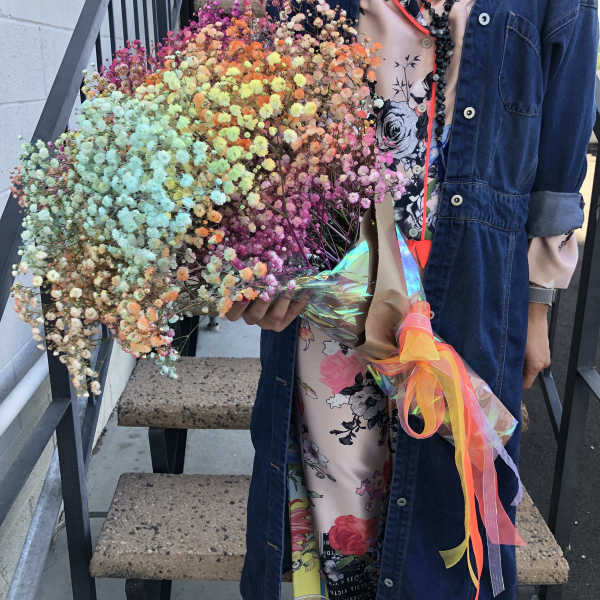Large bouquet of multicolored baby's breath wrapped with ribbon