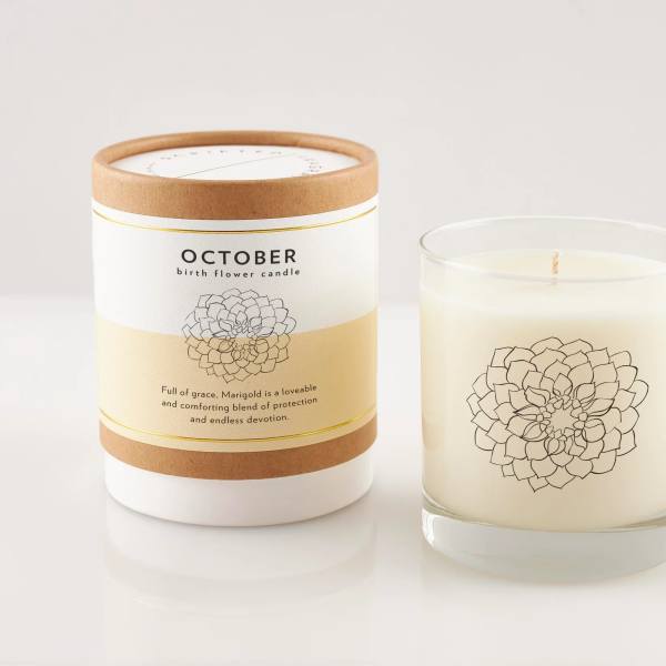 Two October birth flower candles, one in a box and one in a glass jar