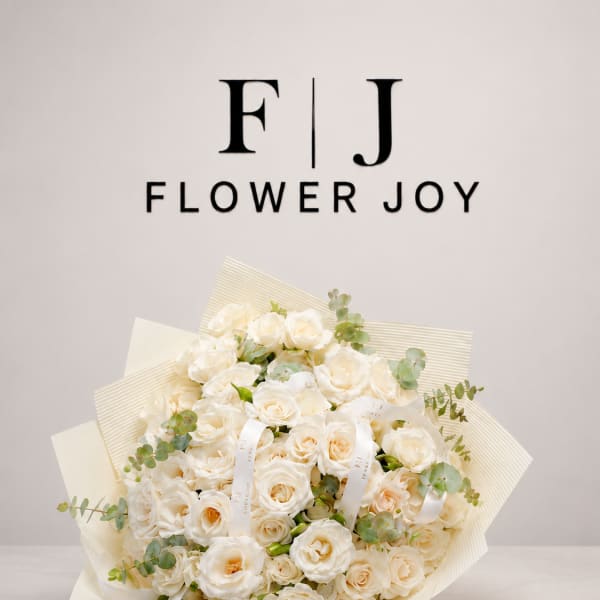 Bouquet of cream roses with eucalyptus accents and ribbon ties