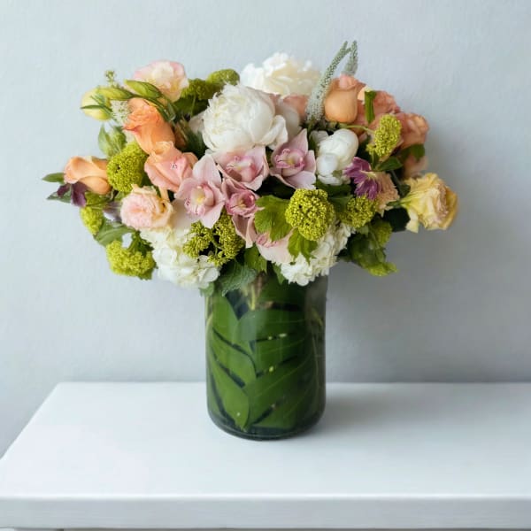 Mixed pastel bouquet in a glass vase