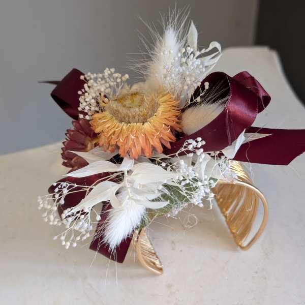Gold corsage cuff.