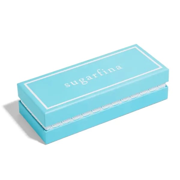 Turquoise rectangular gift box with the word "sugarfina" on the lid