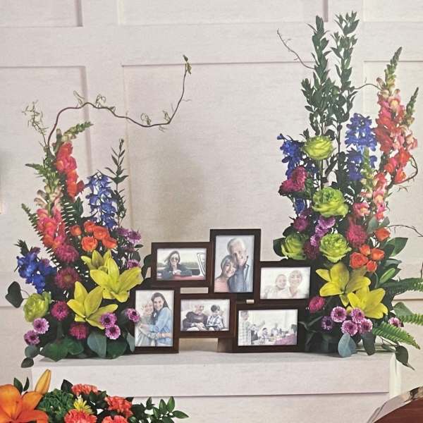 Colorful floral display framing a set of family photo frames