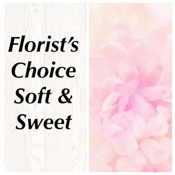 Soft pink floral arrangement with a "Florist's Choice" sign