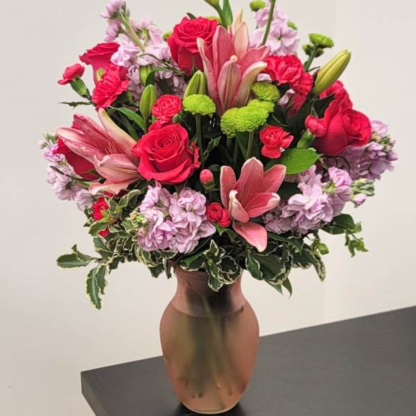 Pink and red flower arrangement in a vase