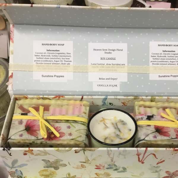 Gift box with floral soap bars and a candle