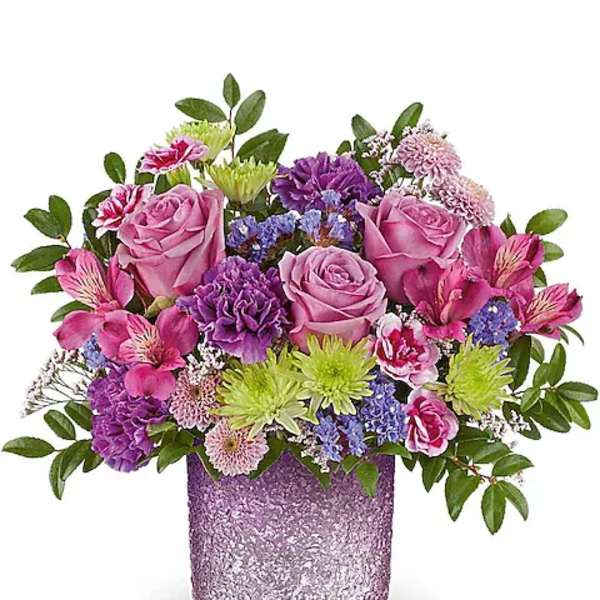 Pink and purple mixed bouquet in a glittery lavender vase