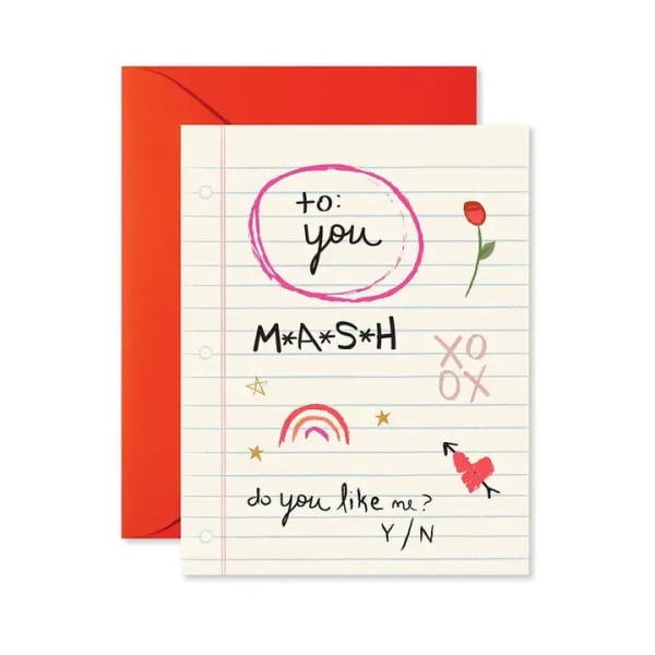 A greeting card with handwritten text and a red envelope