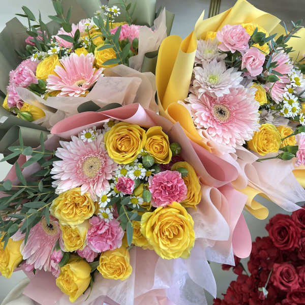 Florist Choice-Spring Pinks & Yellow Wrapped Bqt