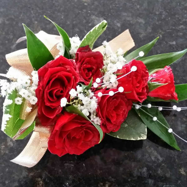 Red rose bouquet with white baby's breath and ribbon
