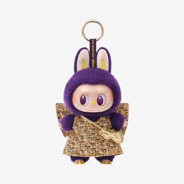 Purple plush keychain doll with bunny ears and a gold outfit