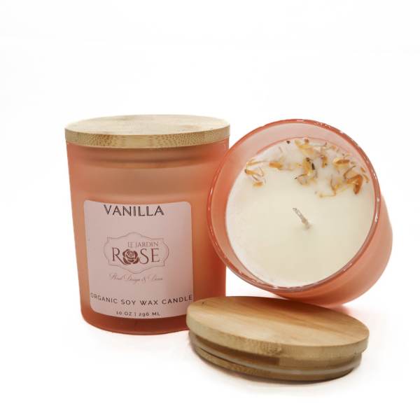 Two vanilla candles in frosted glass jars with bamboo lids