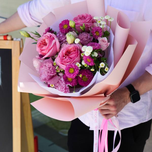 Pink rose bouquet wrapped in pale pink paper
