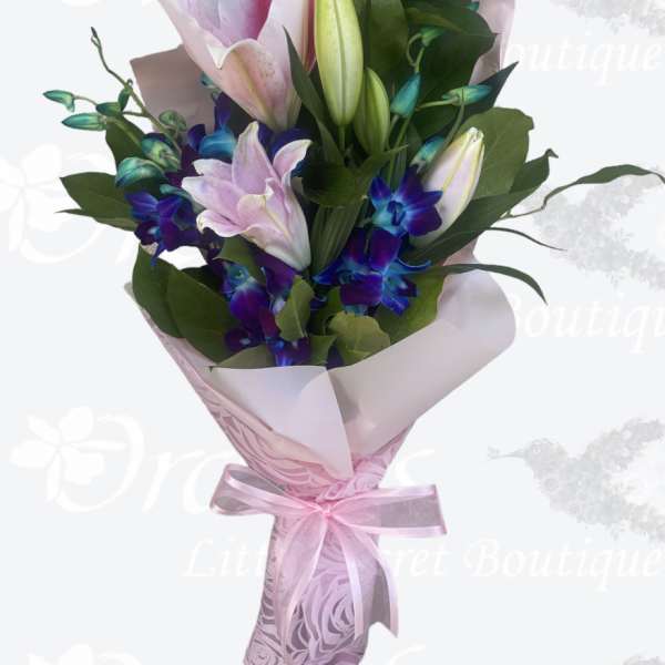 Pink and white lily bouquet with purple orchids wrapped in pink paper