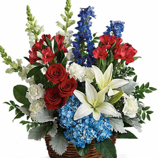 Red, white, and blue flower basket with roses, lilies, carnations, hydrangea, snapdragons, and delphinium